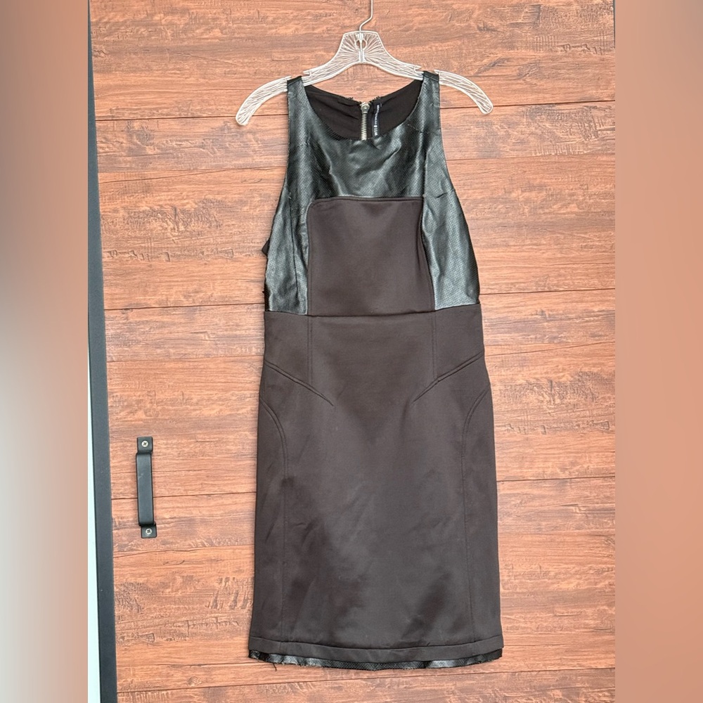 Polyester and leather 
Black
Silver zippers in back
Knee high